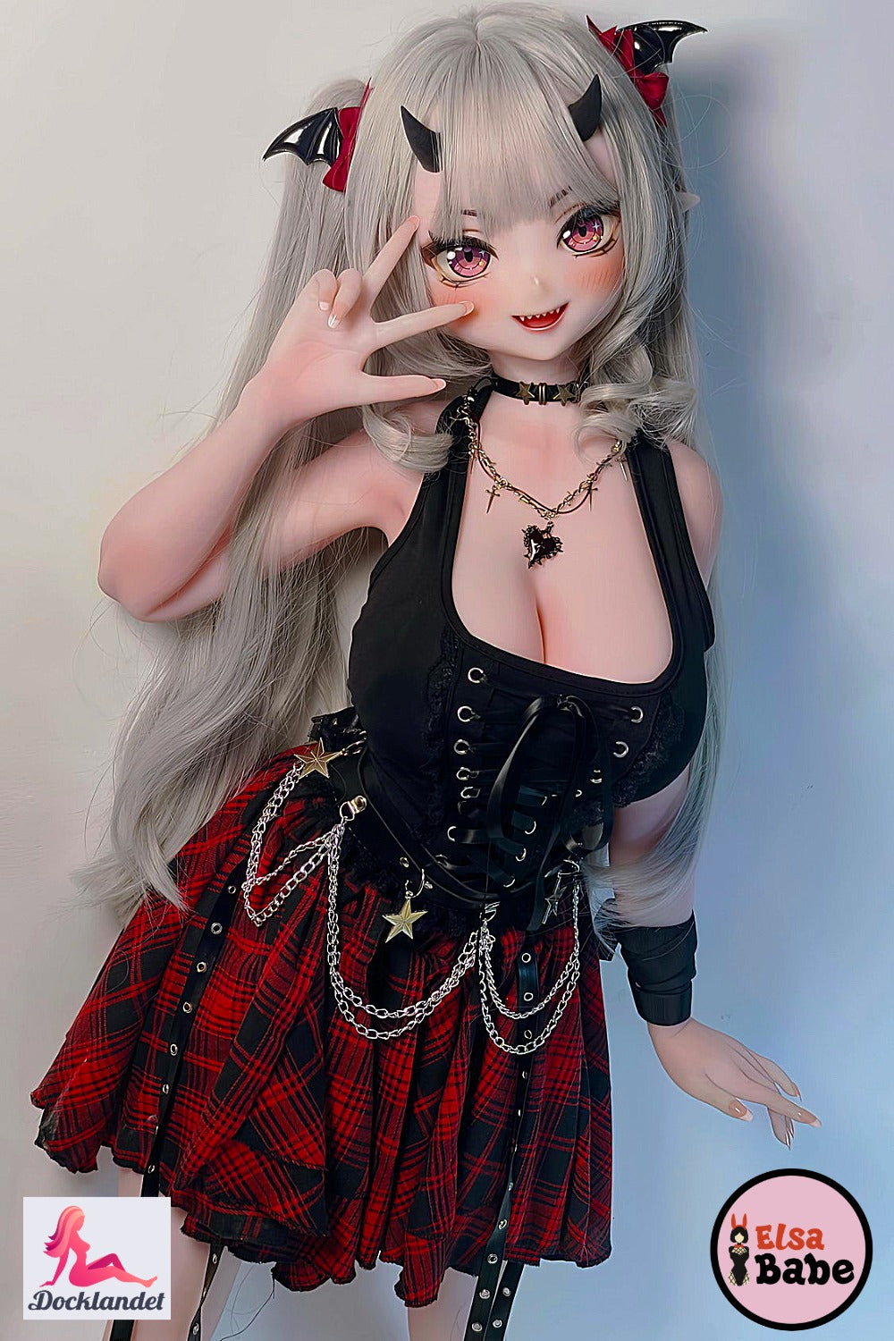 Tachibana Mano 148 cm Elsa Babe anime silicone doll with light hair, pink eyes, horns and black fantasy outfit.